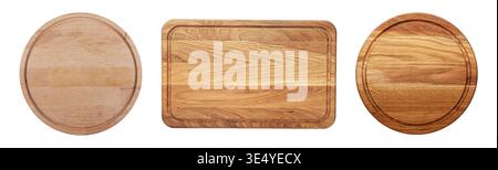 Collection of wooden cutting boards of different shapes isolated on white background. Round and rectangular boards with juice grooves, top view. Kitch Stock Photo