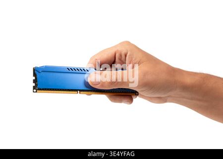 Male hand holding Blue DDR RAM Memory Stick Isolated on white background Stock Photo