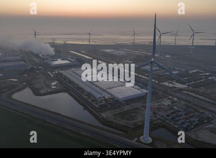 Aerial view of a large hyperscale data center in eemshaven, netherlands, leveraging renewable wind turbine power Stock Photo