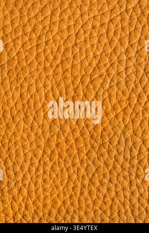 Yellow textured leather closeup as a background Stock Photo