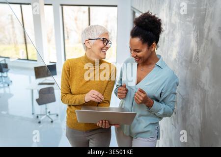 Happy software developers working on meeting, Programming advanced code artificial intelligence. Stock Photo