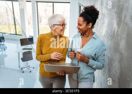 Busy business people, programmers software developer engineer working on computer in office Stock Photo