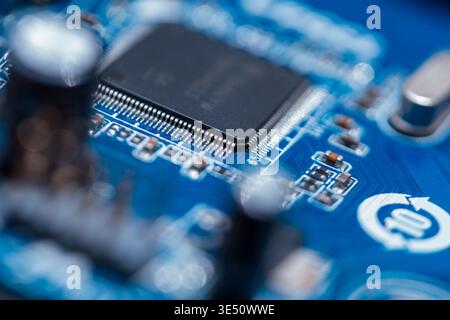 Motherboard with chips, processor and transistors, close-up. Computer and hardware Stock Photo
