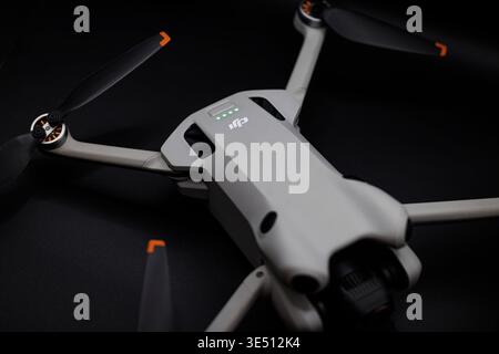 OURENSE, SPAIN - MARCH 25, 2026: Close-up of DJI drone and remote controller on a dark background. Minimal composition highlighting aerial technology Stock Photo