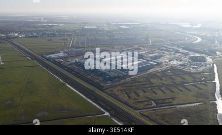 Groningen, Netherlands - 20 January 2026: Aerial view of Datacenter Westpoort featuring a large industrial building with solar panels surrounded by gr Stock Photo