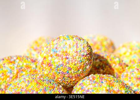 Colorful sprinkle-covered chocolate truffle ball stack for party dessert and sweet celebration Stock Photo