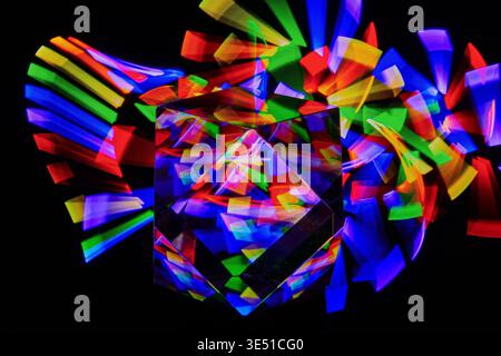 A colorful,abstract Crystal cube on a black background. Stock Photo