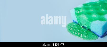 Colorful cleaning sponge with detergent foam, banner format Stock Photo
