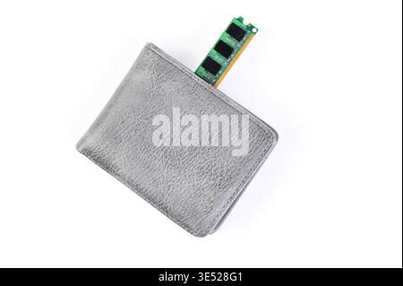 Computer memory module sticking out of a gray leather wallet on white background Stock Photo