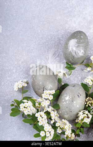 Decorative easter eggs with white flowers spring composition Stock Photo