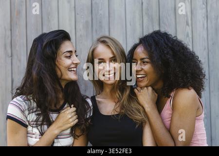 Three beautiful young women having fun outdoors Stock Photo