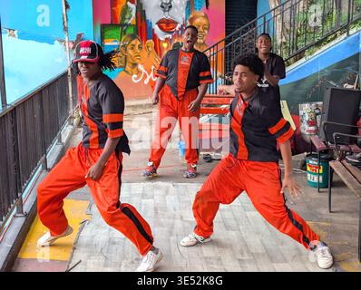 Dancing to the music, these young men put on quite a performance in Comuna 13 Stock Photo
