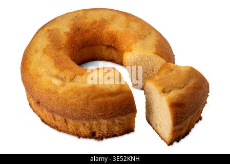 Freshly baked bundt sponge cake with slice isolated on white with clipping path Stock Photo