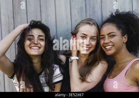 Multiracial female friends having fun outdoors, looking at camera Stock Photo
