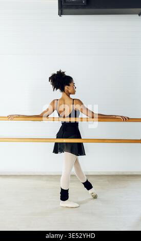 Ballet dancer practicing moves in studio Stock Photo