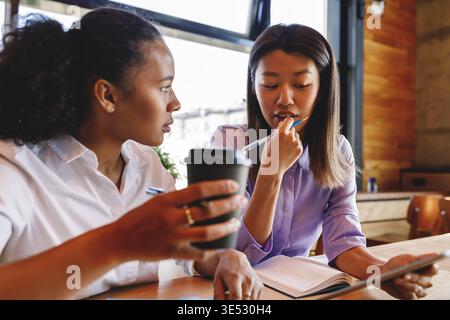 Two business partners discussing new ideas on coffee break Stock Photo