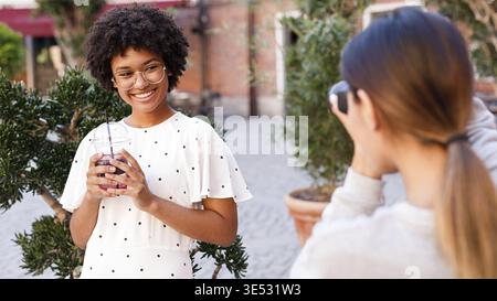 Photographer collaborating with a blogger. Two women creating content for social media Stock Photo
