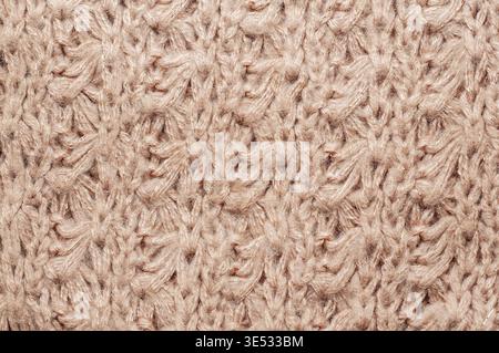 This detailed shot showcases the intricate patterns and soft texture of a cozy knitted material, perfect for backgrounds and design Stock Photo