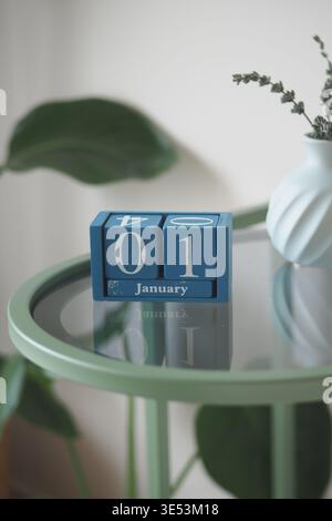 January first with calendar blocks on a green table Stock Photo
