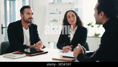 Recruitment, meeting or business people with discussion in office, finance agency or hiring process. Headhunting, talk or hr management team with Stock Photo