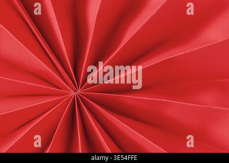 Minimal abstract red folded paper, fan radial geometric pattern, smooth texture, modern background for design and creative layout. Paper Fan geometric Stock Photo