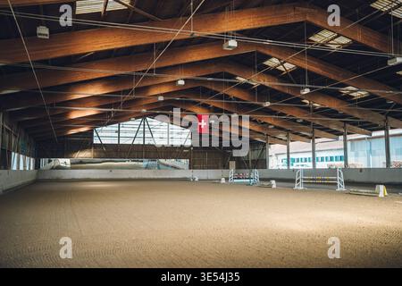 No Racisim Flags Empty horse riding arena with hurdles and flags prepared for a ...