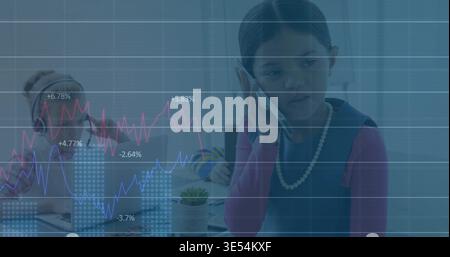 Holding phone girl wearing pearls leading meeting at table in bright room laptop or headphones or ch Stock Photo