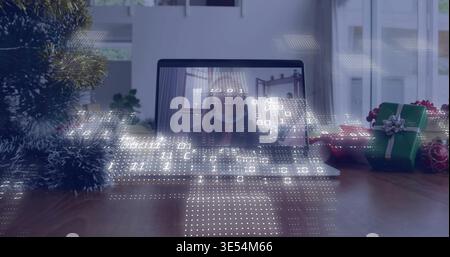 Displaying laptop showing masked woman on call at wood table, with digital overlay and gifts Stock Photo