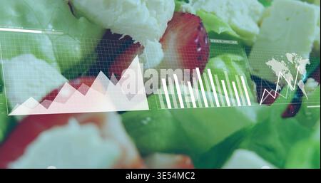 Displaying closeup salad on plate, showing lettuce, strawberry slices, crumbled feta, HUD overlays Stock Photo