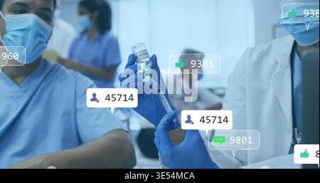 Filling syringe from vaccine vial with nitrile gloves in clinic showing surgical masks and overlays Stock Photo