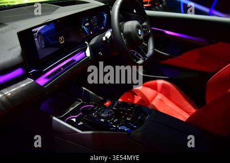 Thailand-March 26,2026:Luxury interior of the new BMW M5 (G90) featuring red leather sports seats, M sport steering wheel with BMW Interaction Bar.at Stock Photo