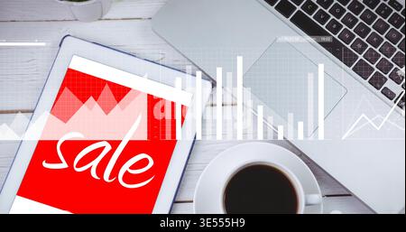 Displaying tablet-notebook showing red-sale graphic, white desk with laptop and charts, copy space Stock Photo