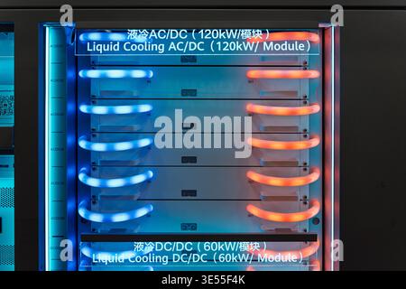 Liquid cooling system for AC/DC and DC/DC power modules in server rack, high power 120kW and 60kW energy management units with illuminated blue inlet Stock Photo