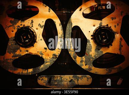 Professional vintage reel-to-reel magnetic tape recorder with analog controls. Detailed close-up of retro audio equipment used for high-quality sound Stock Photo