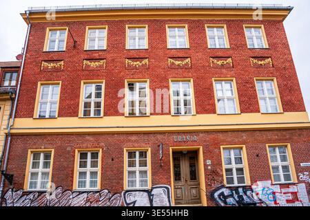 Urania entrance. Classic old red brick three-story house. Facade of the 19th century building Architecture wall. Potsdam, Germany - October 26, 2025 Stock Photo