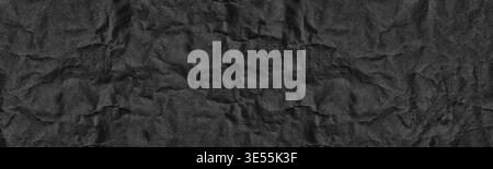 Black old crumpled paper wide panoramic texture. Wrinkled dark paper sheet surface. Abstract large banner vintage grunge background Stock Photo