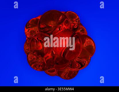 3D rendering of an abstract Liquid Glass cluster composed of smooth interconnected bubble-like forms with a highly glossy reflective surface. Stock Photo