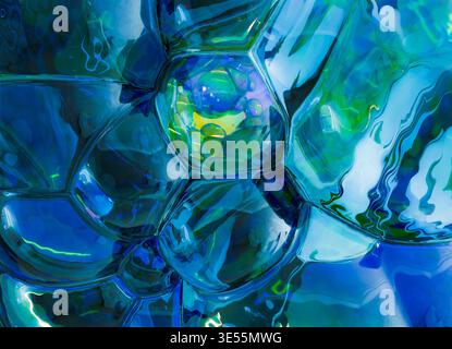 3D rendering of an abstract Liquid Glass blob composed of soft, rounded organic forms merging into a single fluid structure. Stock Photo