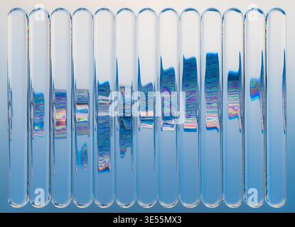 3D rendering of an abstract composition featuring Liquid Glass vertical tubes arranged in a clean repeating structure. Stock Photo