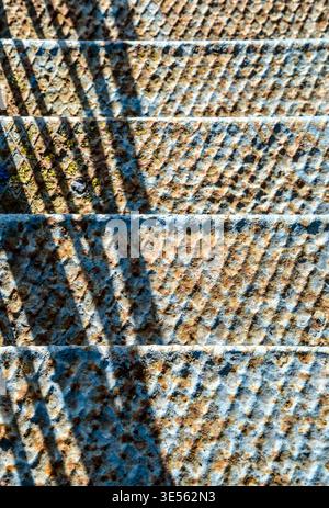 old, blue, rusty stairs going down Stock Photo