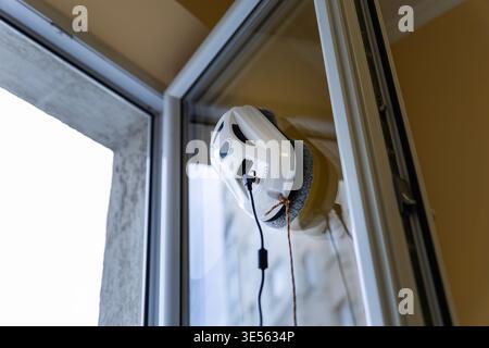 Close up of a White Window Cleaning Robot Working on Glass Stock Photo