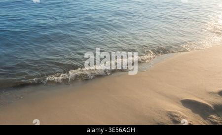 Soft beautiful ocean wave on sandy beach. Background. Stock Photo
