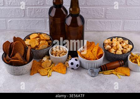 Beer and different snacks for Superbowl or football party Stock Photo