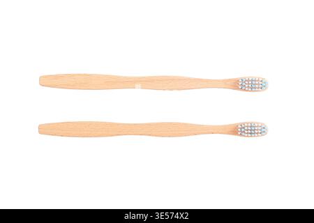 Eco friendly bamboo toothbrushes isolated on white background, top view. Stock Photo