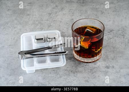 Whiskey in a glass with metal cubes to preserve the flavor Stock Photo