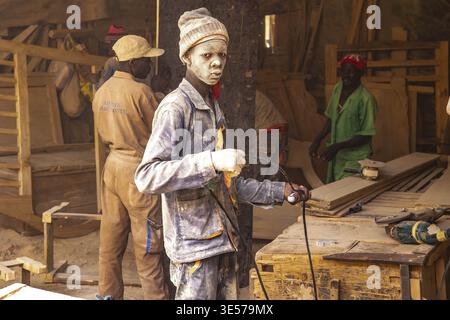 Albino worker in a carpentry workshop in Kigali, Rwanda Stock Photo