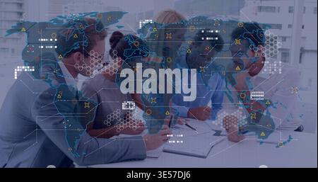 Reviewing team in business attire leaning over table, studying documents with world map overlay Stock Photo