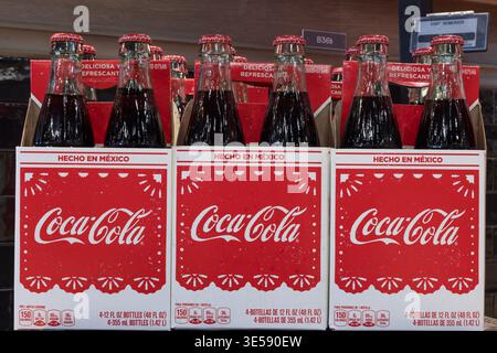 Carmel - March 28, 2026: Coca-Cola soda sourced from Mexico. Coke soft drink sourced from Mexico uses real sugar instead of corn syrup sweetener. Stock Photo