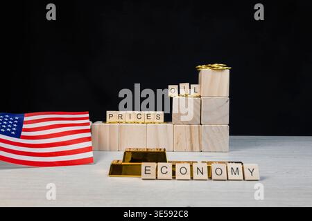United States flag, gold bars, and golden coins representing the economy and oil prices with increasing wooden blocks showing a rising trend for commo Stock Photo