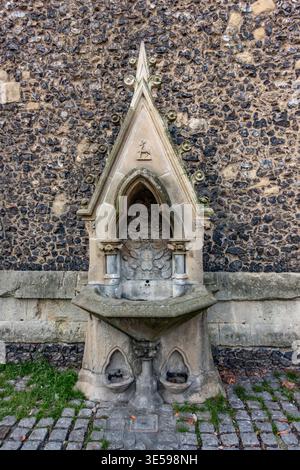 An old drinking fountain on the side of a church in Reading, UK Stock Photo